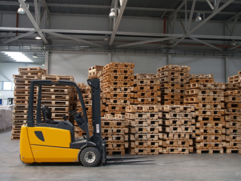 Forklift ready for work in a real warehouse